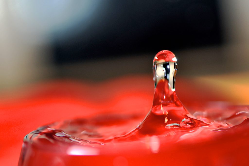 Water dropping into a glass