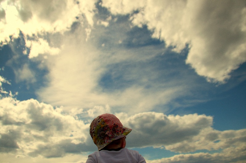 Child looking at clouds