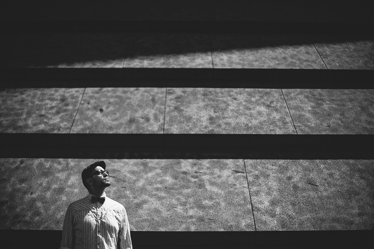 man contemplation bw light lines